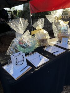 Baskets with various objects with clipboards in front of them.