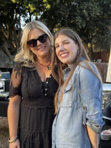 Two women standing close together.