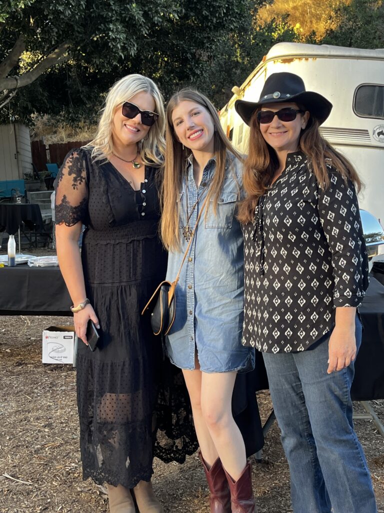 Three women standing together.