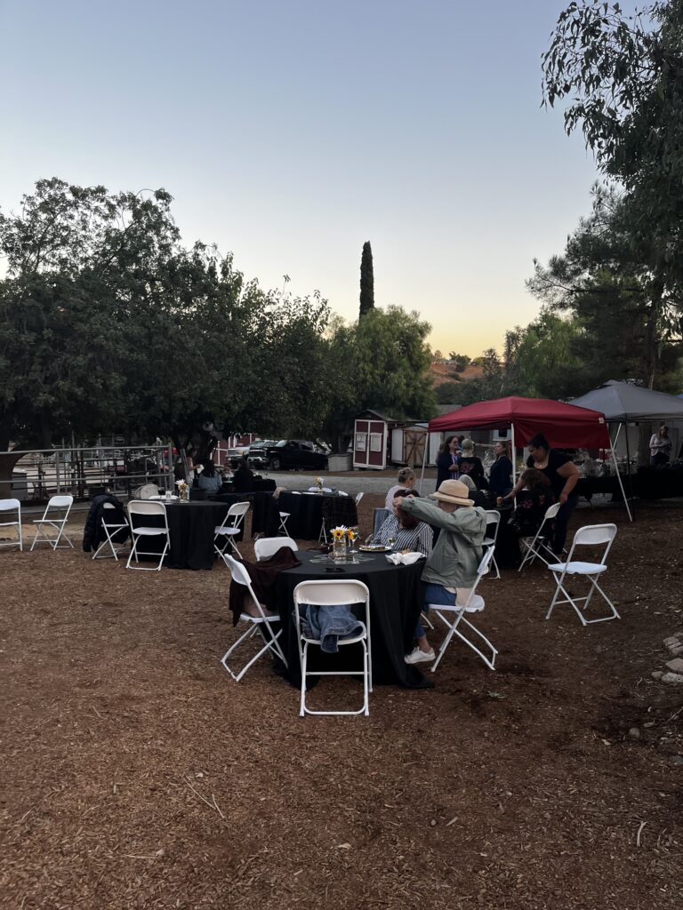 Tables and chairs set up in the middle of the ranch